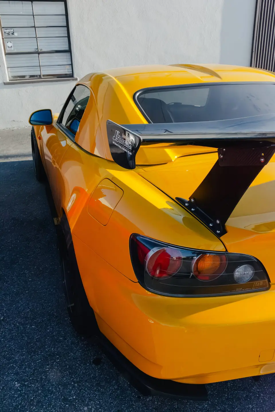 Yellow Honda S2000 paint correction and ceramic coating — studio photo 80