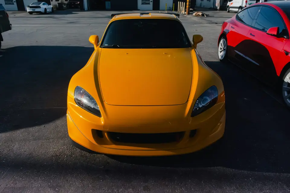 Yellow Honda S2000 paint correction and ceramic coating — studio photo 96