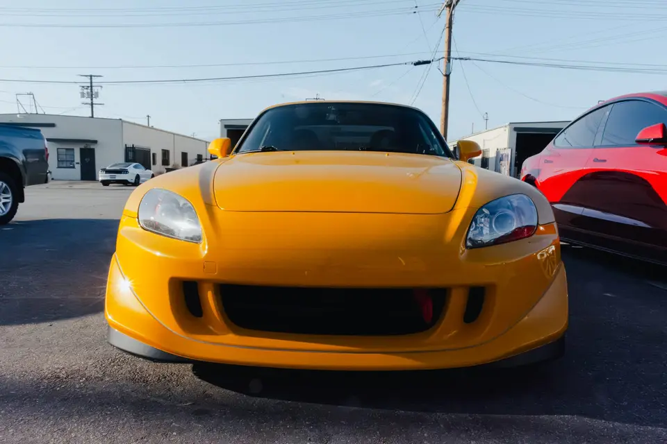 Yellow Honda S2000 paint correction and ceramic coating — studio photo 98