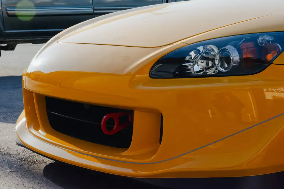 Yellow Honda S2000 paint correction and ceramic coating — studio photo 100