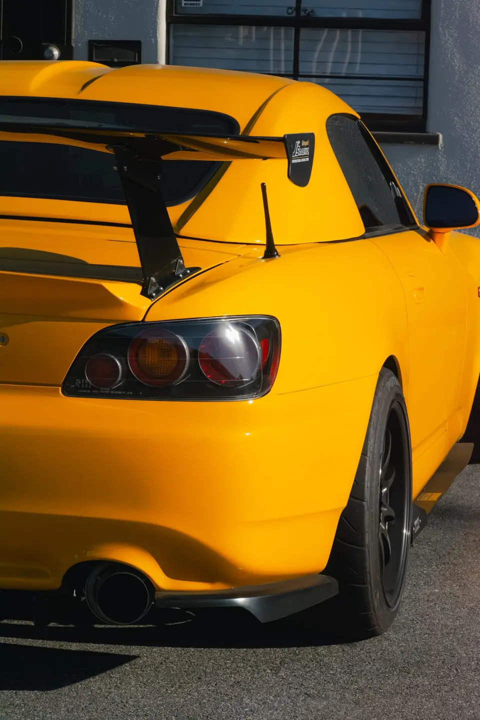 Yellow Honda S2000 paint correction and ceramic coating — studio photo 85