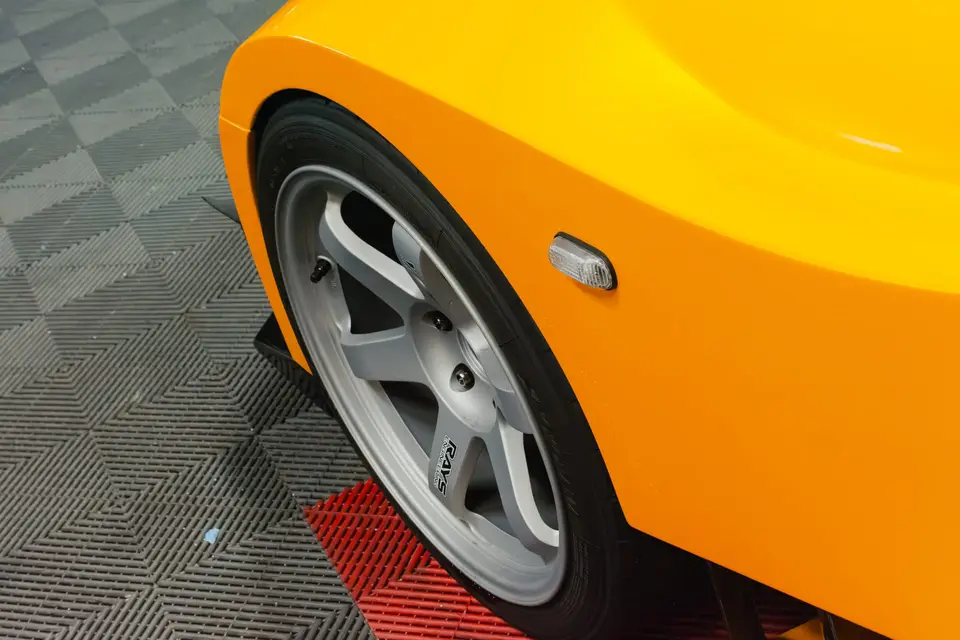 Yellow Honda S2000 paint correction and ceramic coating — studio photo 13