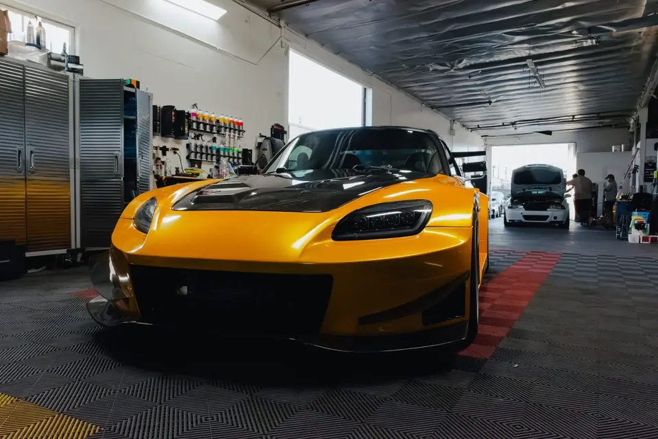 Yellow Honda S2000 paint correction and ceramic coating — studio photo 23
