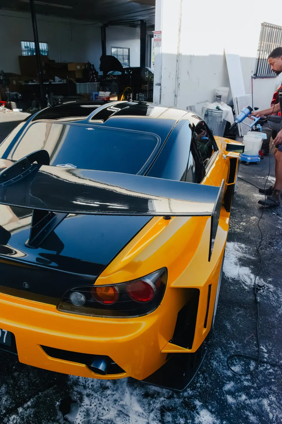 Yellow Honda S2000 paint correction and ceramic coating — studio photo 39