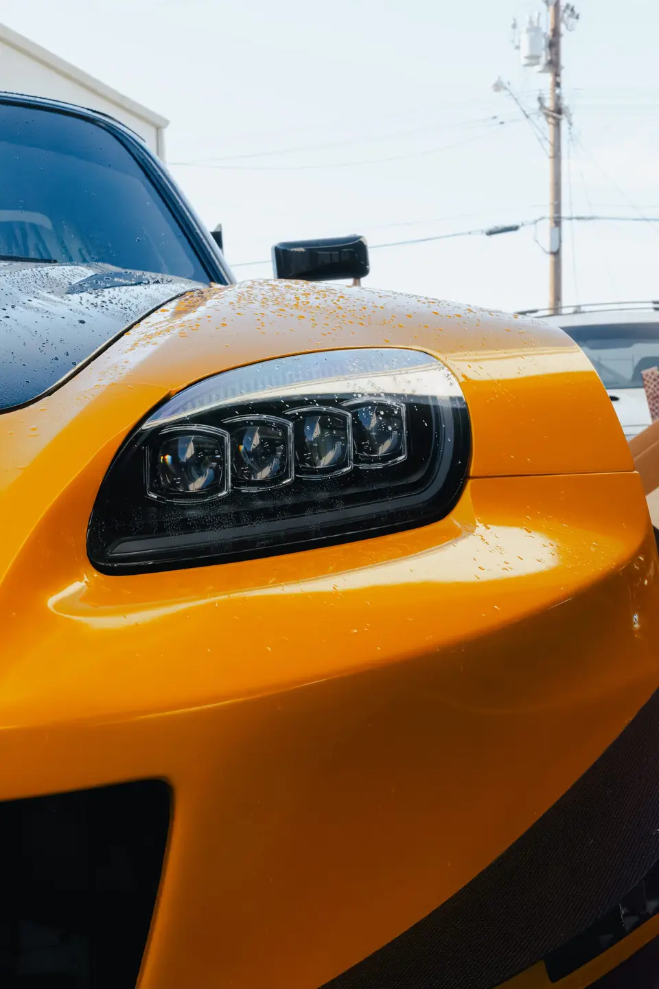 Yellow Honda S2000 paint correction and ceramic coating — studio photo 54