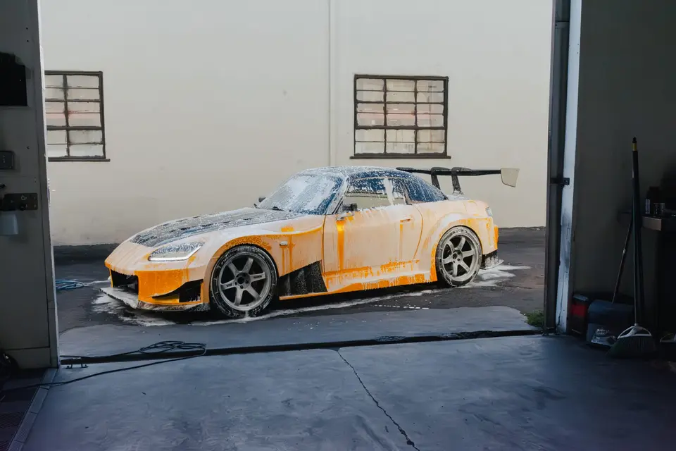 Yellow Honda S2000 paint correction and ceramic coating — studio photo 59