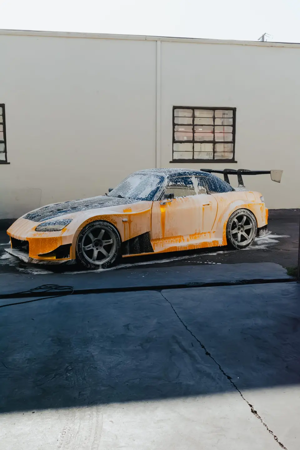 Yellow Honda S2000 paint correction and ceramic coating — studio photo 60