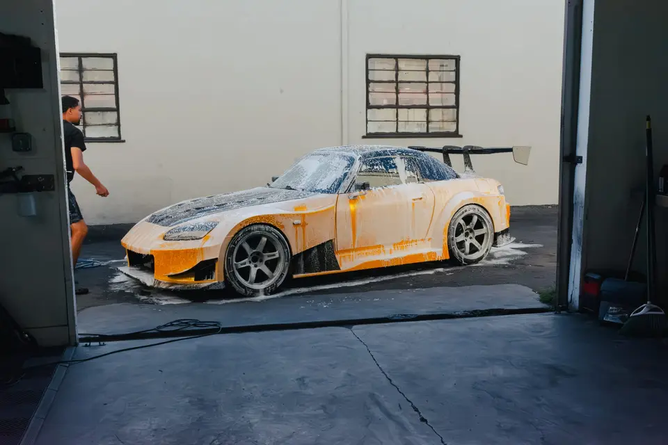 Yellow Honda S2000 paint correction and ceramic coating — studio photo 61